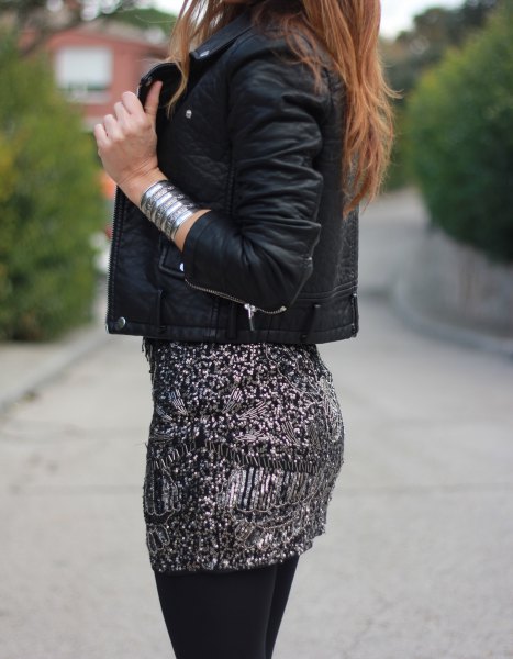 black leather jacket with a figure-hugging mini skirt