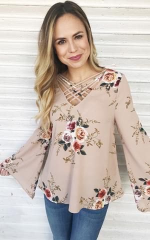 Pale pink floral blouse and skinny jeans