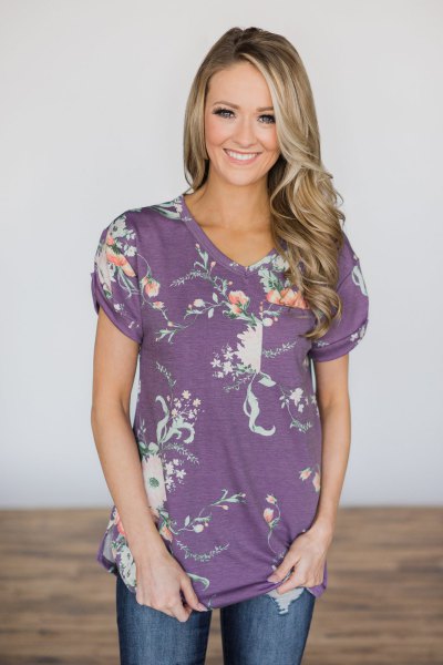 purple and white floral t-shirt with blue jeans
