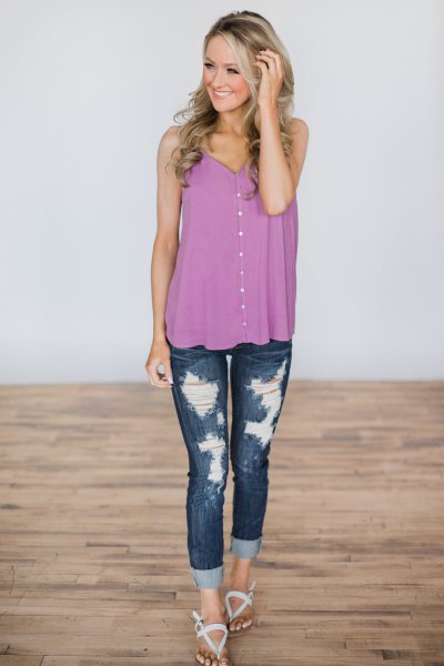 purple buttoned vest with ripped skinny jeans