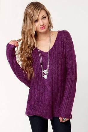 purple knit V-neck sweater and black skinny jeans