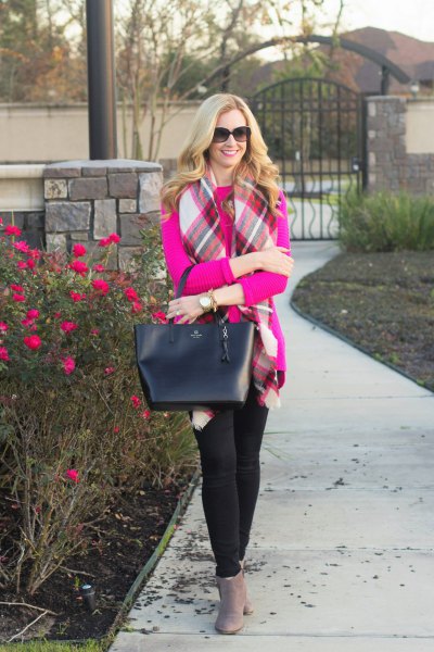 Pink colored sweater with white and red checked scarf