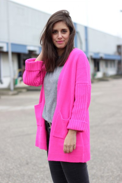 pink cardigan with gray sweatshirt and black jeans