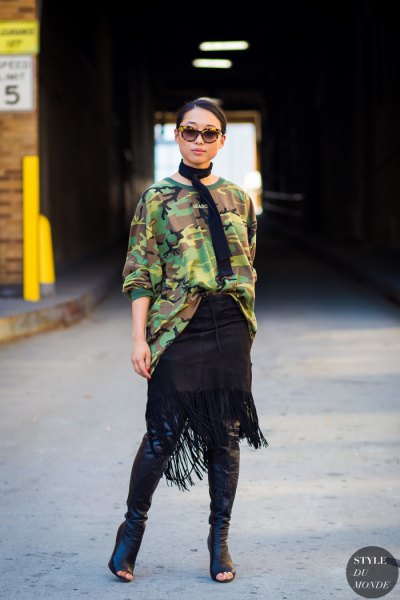 Oversized camo sweater with black leather open toe knee high boots