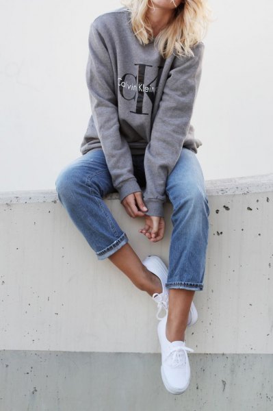 gray sweatshirt jeans sneakers with a round neckline