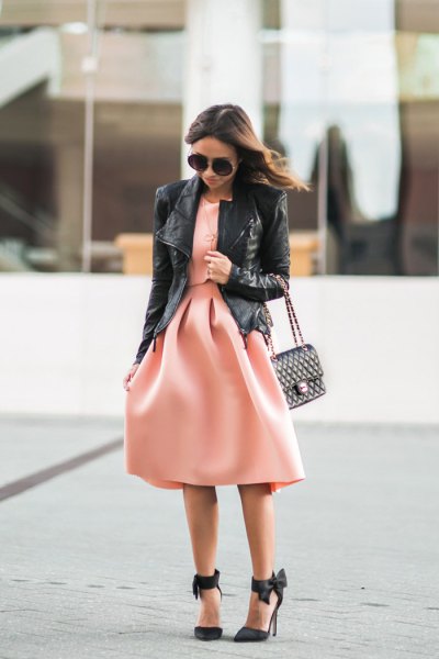 black leather jacket with blush pink fit and flared midi dress
