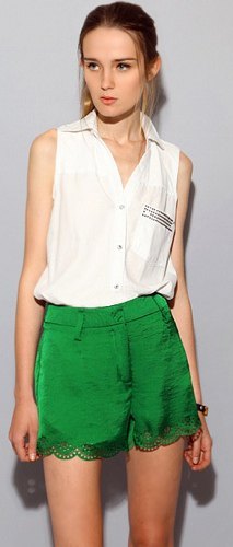 white sleeveless shirt green silk shorts and scalloped lace