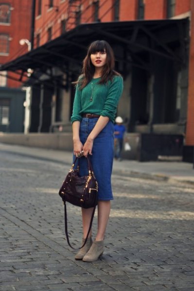 green knit sweater with high-waisted midi denim skirt