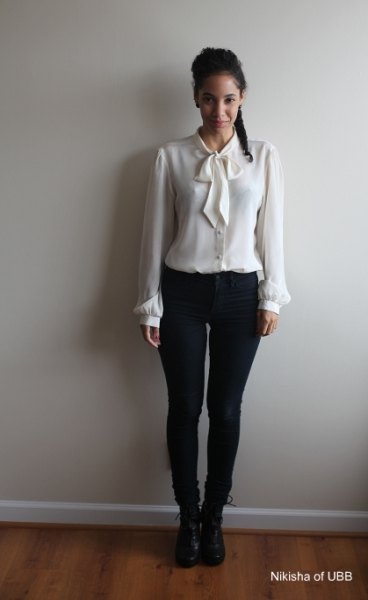 white shirt with matching bow tie and skinny black jeans