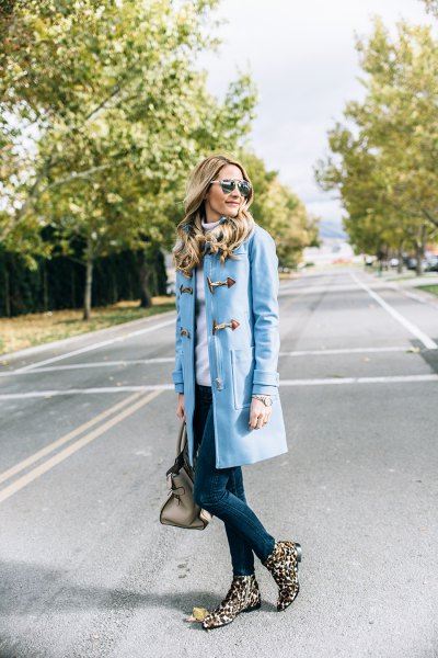 Sky blue skinny jeans with a long trench coat