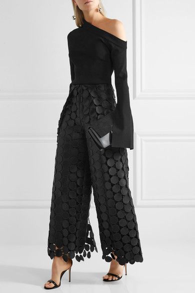 black lace pants over the top with one shoulder