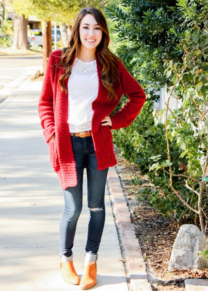 white lace blouse with a red chunky cardigan