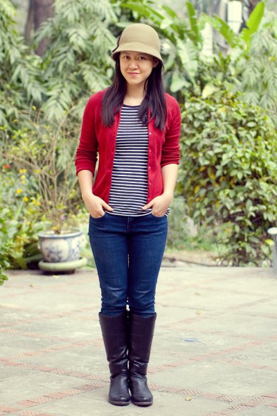 red cardigan with black and white striped t-shirt and bucket hat