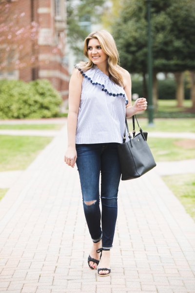 Light blue sleeveless top with shoulder ruffle and skinny jeans