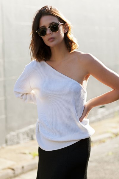 white ribbed one shoulder sweater and black mini skirt