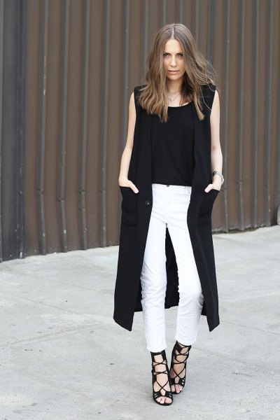 black long sleeveless vest white skinny jeans