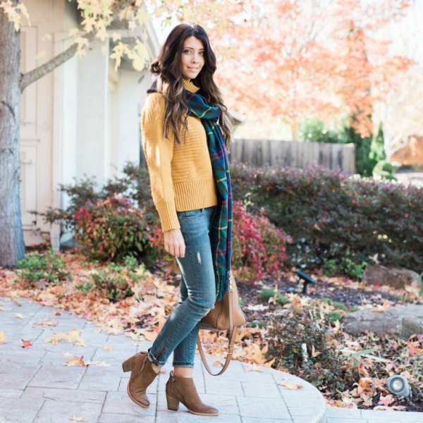 Mock neck sweater with a long dark blue and green plaid scarf