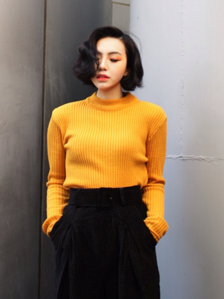 Ribbed yellow sweater with black cropped pants