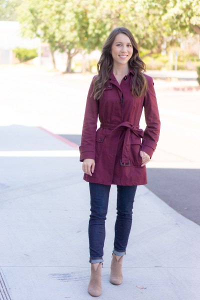 Gray belted parka jacket and dark blue cuffed jeans