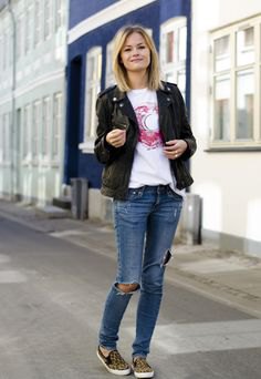 black denim blazer with ripped blue jeans and animal print canvas shoes