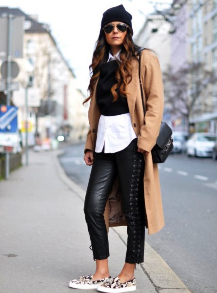 Camel longline wool coat with black leather leggings and animal print canvas shoes