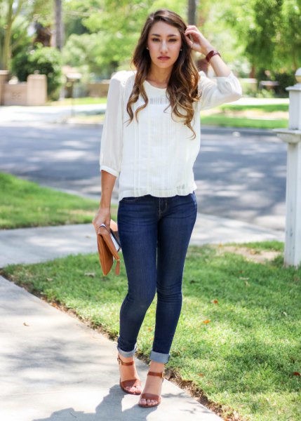 Skinny jeans with a chiffon blouse and cuffs