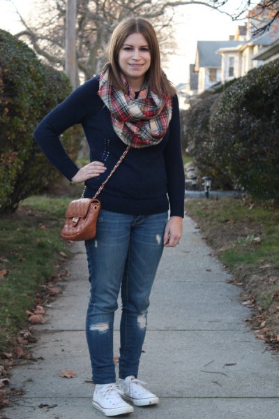 red and white plaid scarf and blue jeans