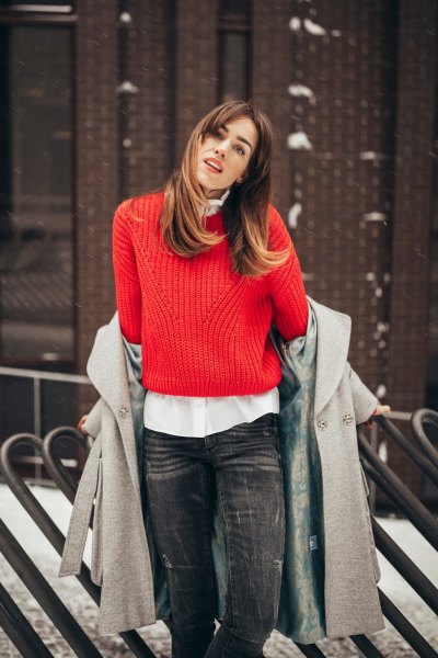 red ribbed sweater with white shirt and gray wool coat