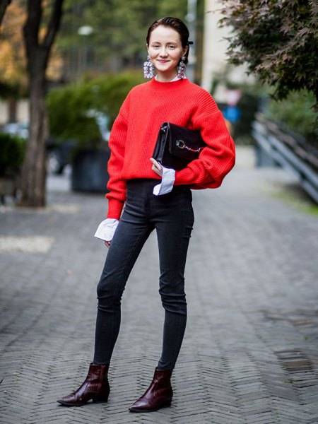 red sweater with black high waisted skinny jeans and ankle boots