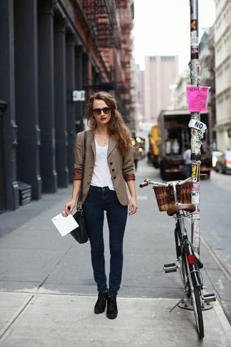brown double-breasted suit with dark blue skinny jeans