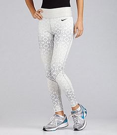 white and light gray patterned Nike running shorts with black t-shirt