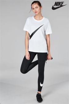 white oversized t-shirt with black nike running shorts