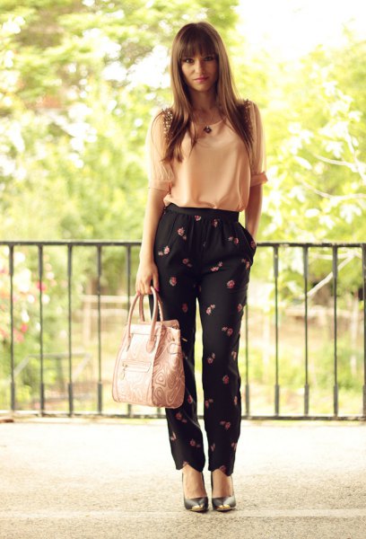 Light yellow chiffon tank top with black pants and floral pattern