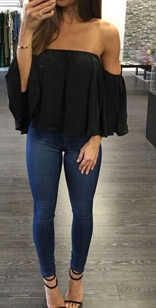 Black strapless chiffon top paired with dark blue super skinny jeans