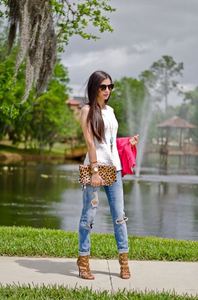 white sleeveless top with long boho necklace and leopard print clutch