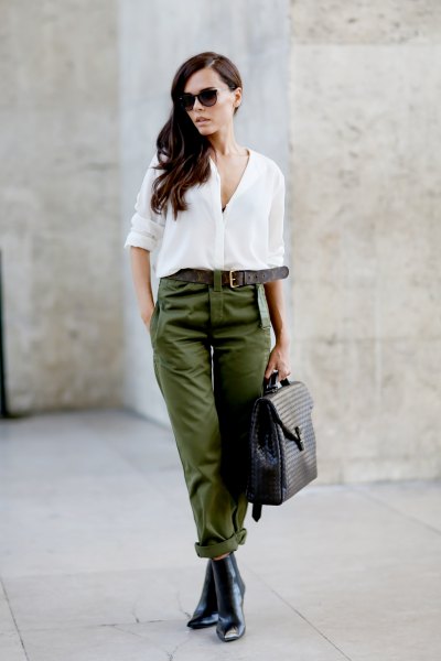 White button-up chiffon blouse, green belted trousers and Chelsea leather boots