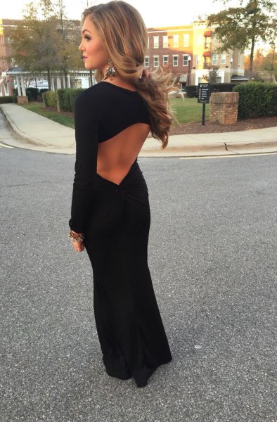 black maxi dress with an open back and long sleeves and ballet flats