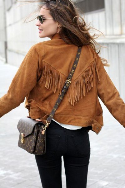 Brown suede jacket with fringes, black skinny jeans