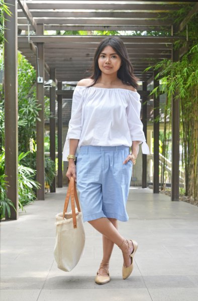 Off-shoulder white blouse with light blue, knee-length, long cotton shorts