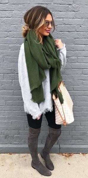 white sweater with green scarf and gray overknee boots