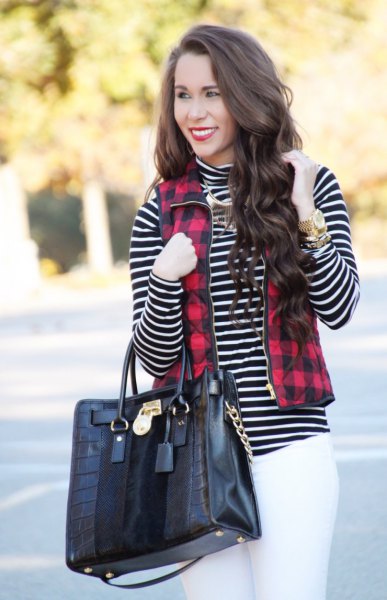 Red and black plaid full zip vest, black and white striped mock-neck top