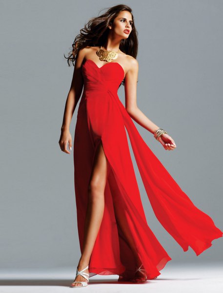 red high-waisted floor-length dress with statement necklace