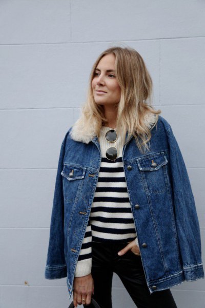 blue denim jacket with white faux fur collar and striped sweater