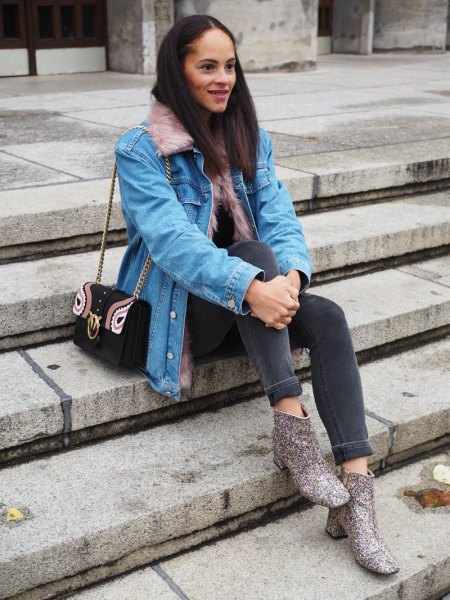 Light blue denim jacket with gray skinny jeans and printed boots