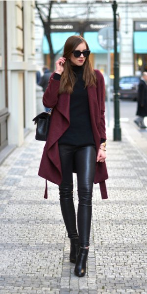 Burgundy trench coat with a black turtleneck and leather leggings