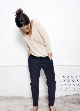 Light pink V-neck sweater and black chinos