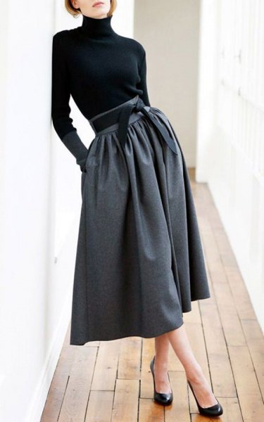 high-necked black top gray midi skirt