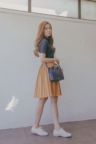 gray short-sleeved turtleneck top and orange skater mini skirt