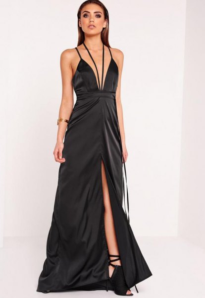 black plunging maxi dress with deep V-neckline and flared high split