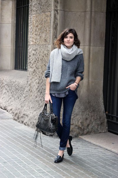 gray ribbed chunky sweater with dark cuffed jeans and leather loafers